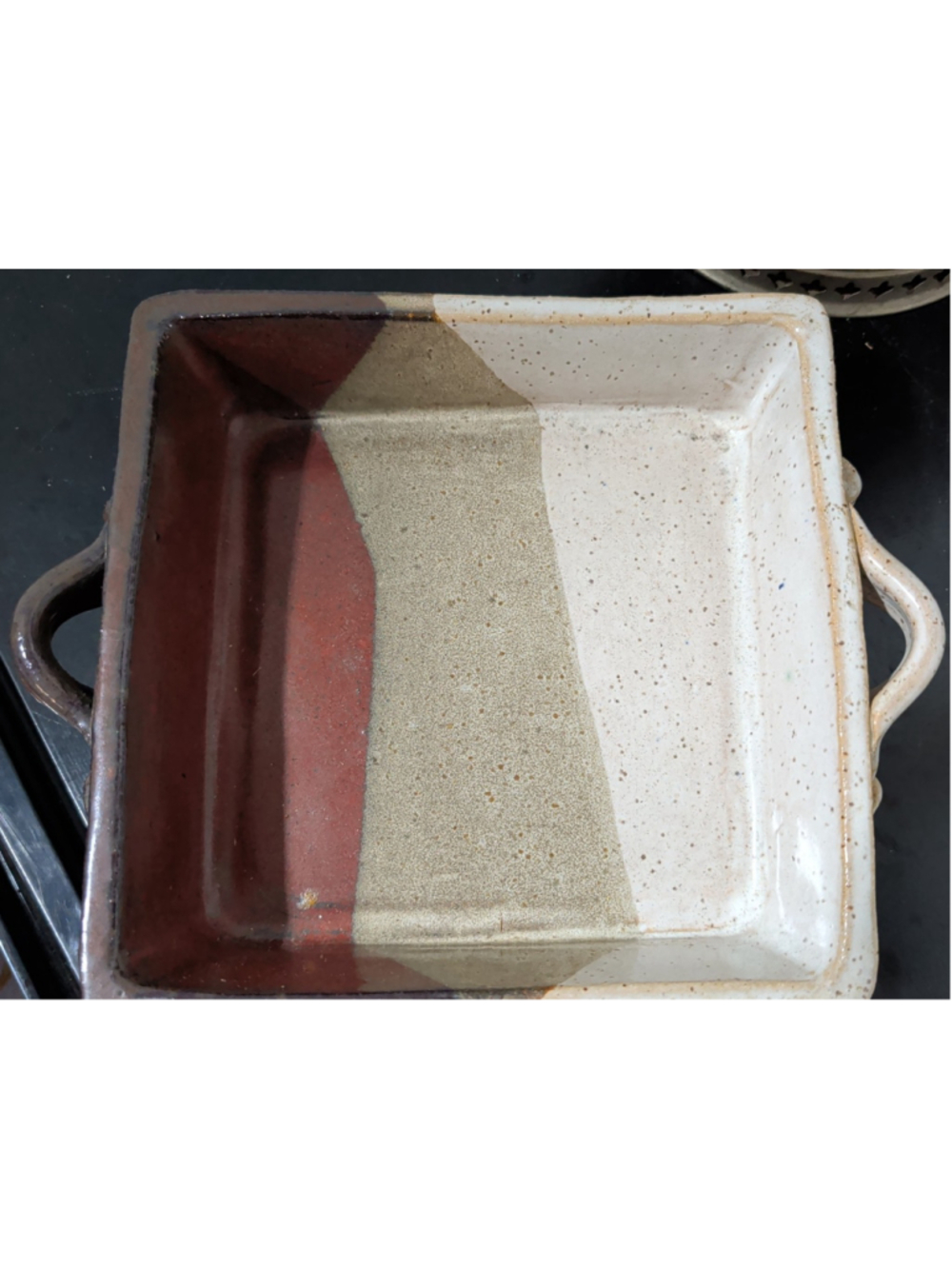 This is a handmade stoneware baking or serving dish crafted by Shiloh Pottery